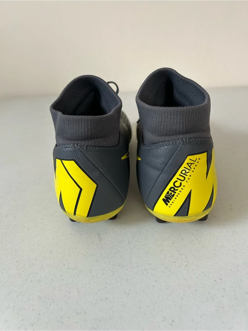 Nike Men’s Black Soccer Cleats with Yellow Swoosh